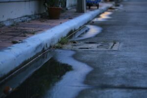 How Poor Drainage Undermines Your Concrete & What to Do